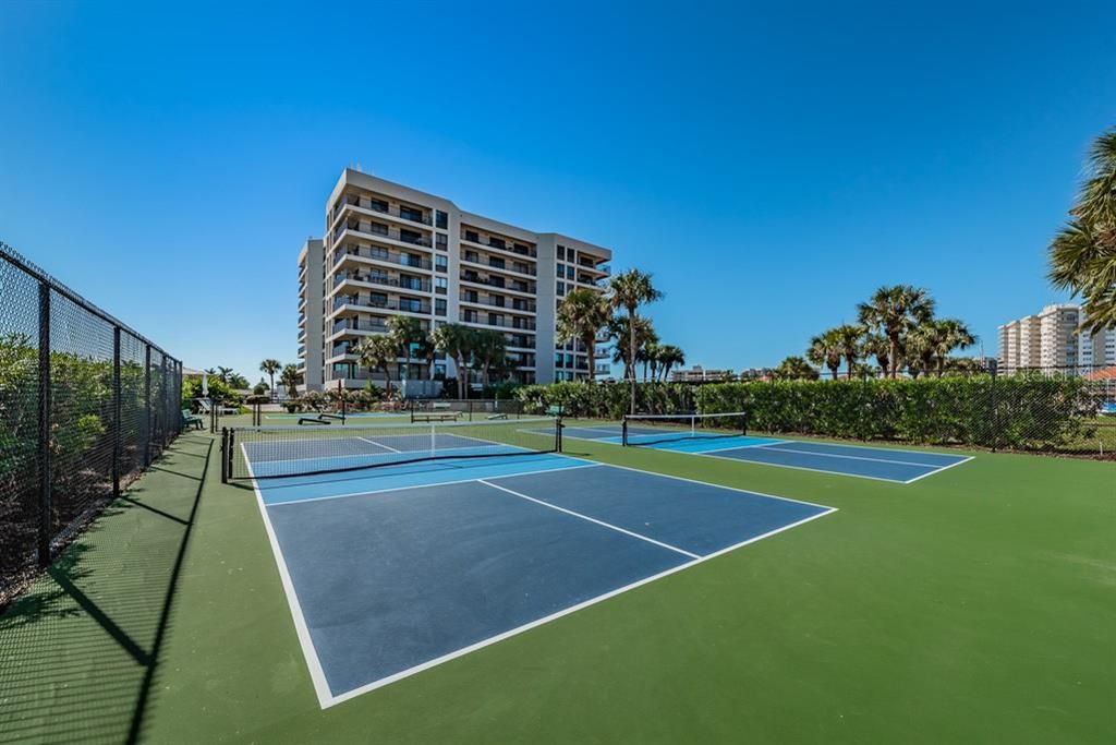 Amenities include waterfront heated pool, tennis, pickle ball, fishing pier, grill and picnic area.