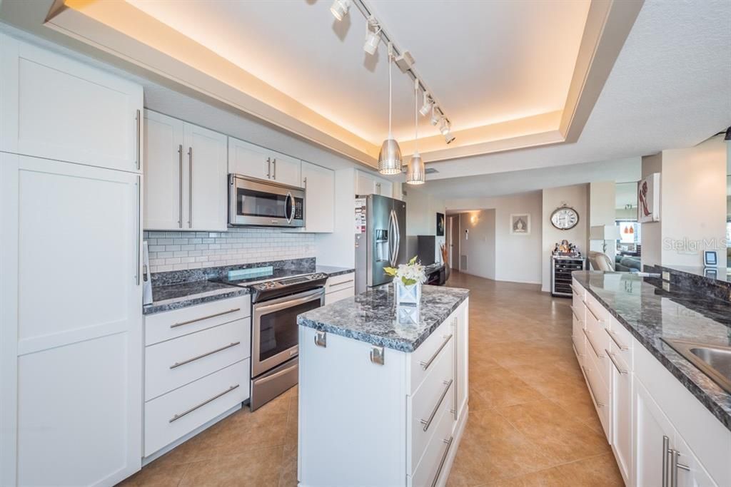 Light & Bright Kitchen features include new stainless steel appliances, wine fridge, and new white shaker style cabinets.