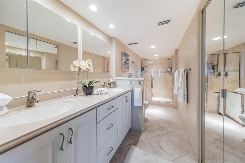 Master Bath with Walk in Closet, Dual Sink Vanity, Soft Close Cabinetry, Tile Surround & a Luxury Walk in Shower.