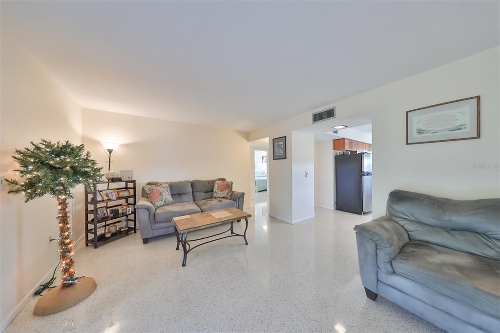 Clean, bright and inviting this space is neutral and ready for a new owner.  The terrazzo is in great condition with a lovely sheen adding to the tranquil feel of this space.
