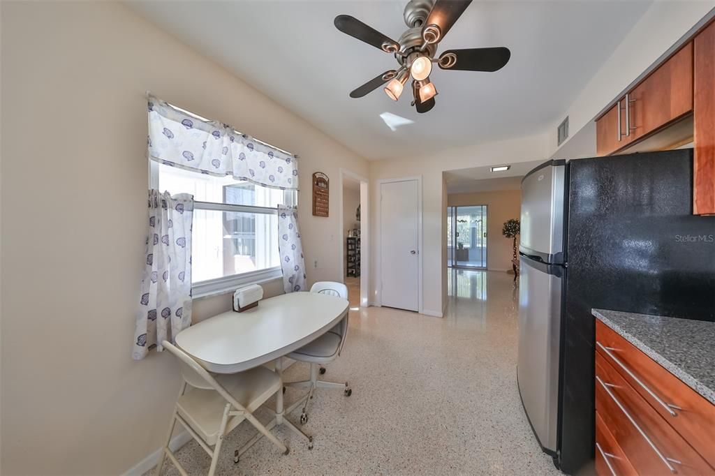 The eat-in kitchen is a good size and bright; with a large pantry and ample storage.