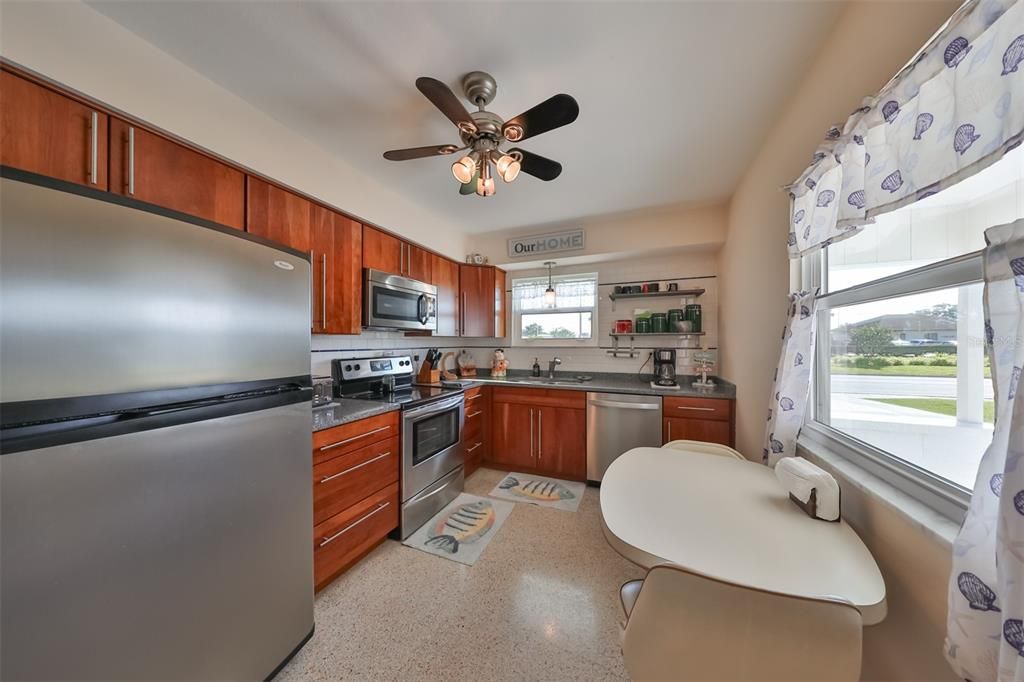 The kitchen boasts of lots of granite counter space, soft close drawers and lovely cabinetry.