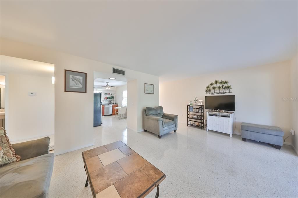 The great room is just off the kitchen area for easy access and an open floor plan feel.