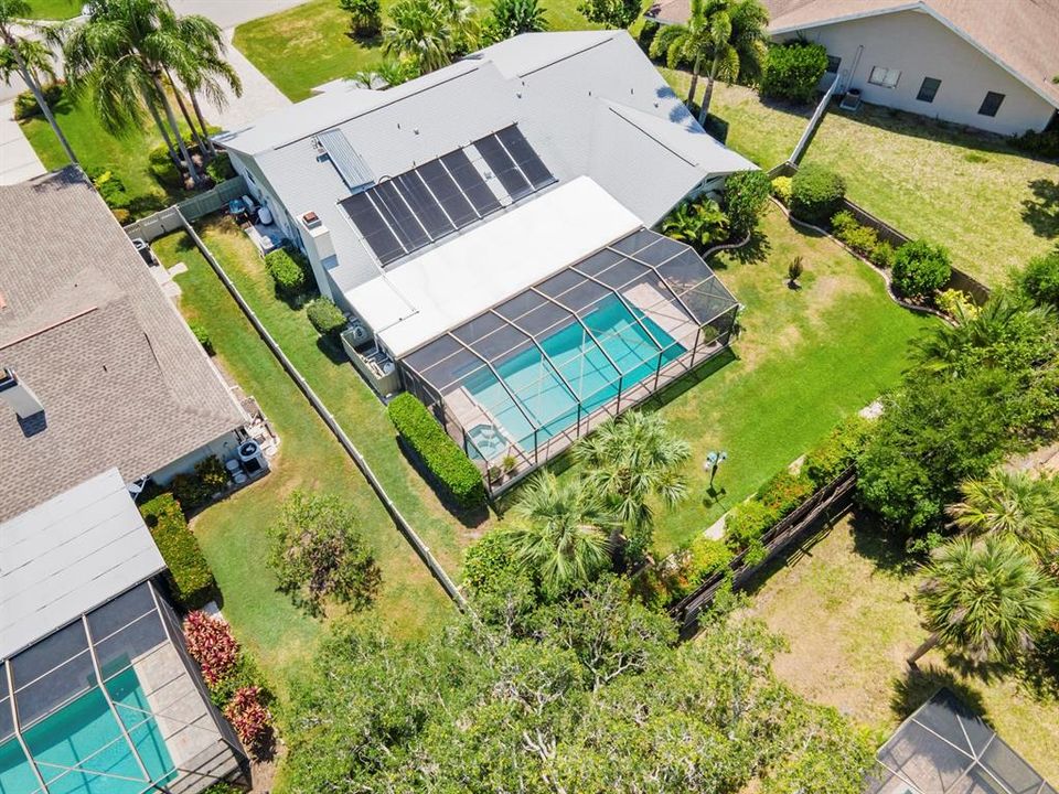 Screened Solar heated Pool and Spa surrounded by Fenced Landscaped Yard.