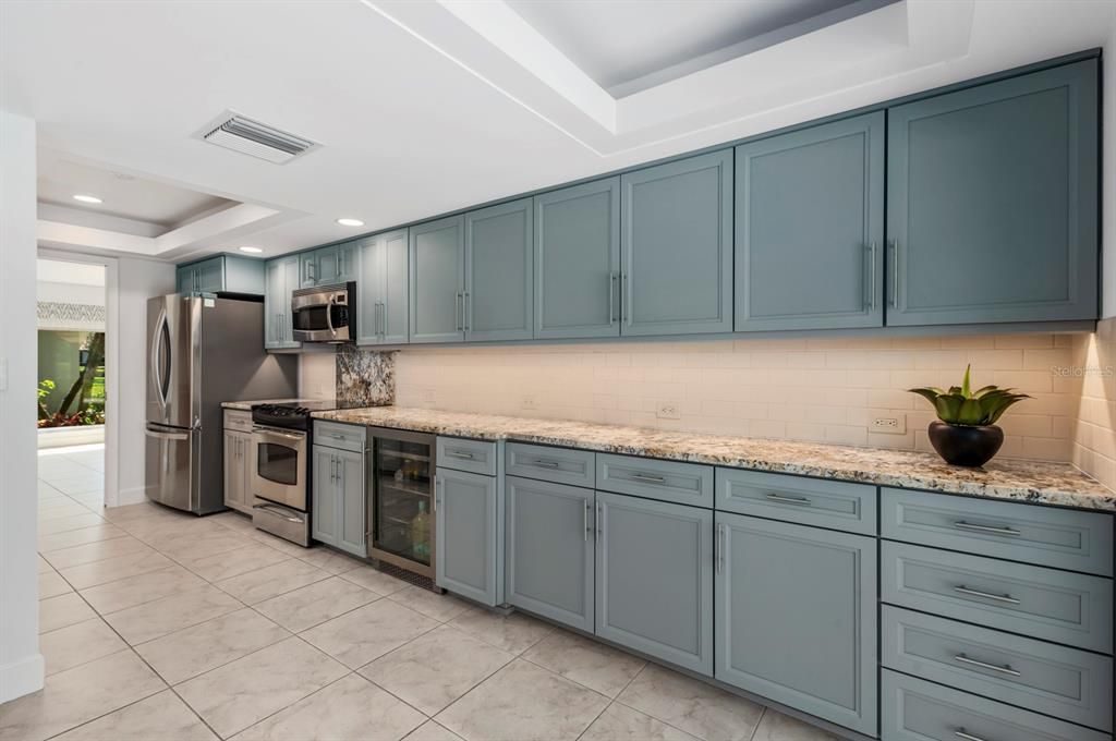 New Cabinet Doors and Drawers with plenty of storage in Kitchen, including Wine Fridge, GE Profile microwave/convection, oven-range, newer Bosch dishwasher and LG fridge.