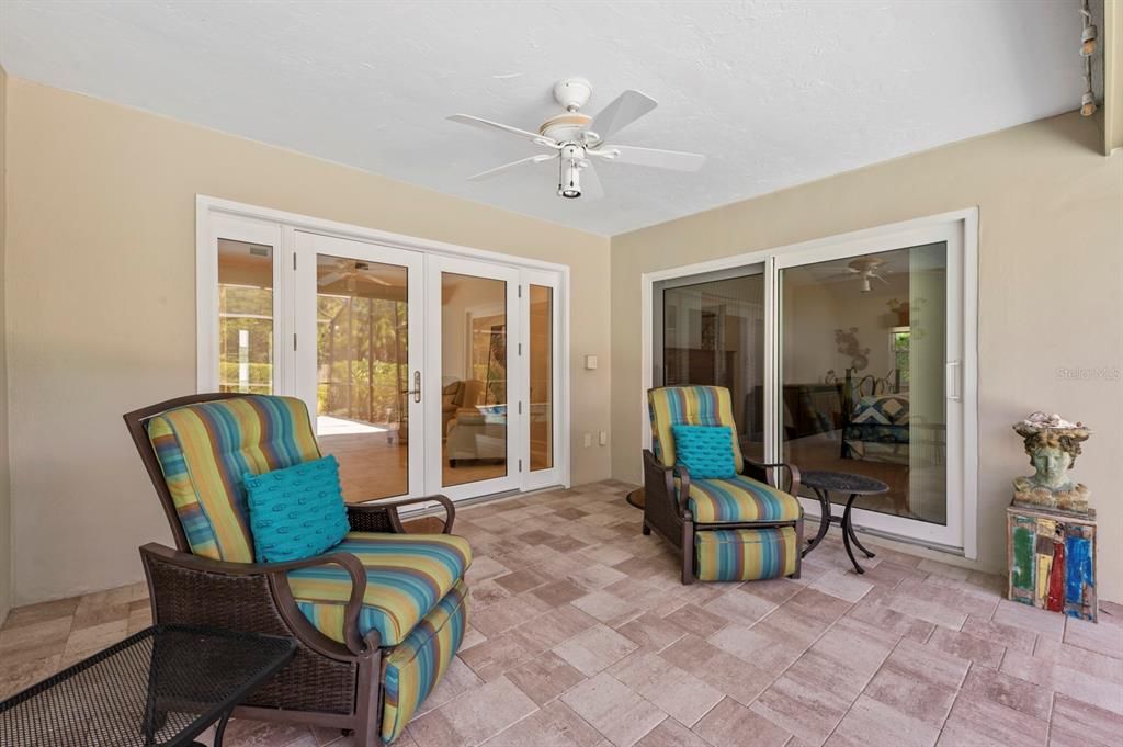 Covered space outside Owner's suite and Living Room. Nice spot to read the paper or a good book.