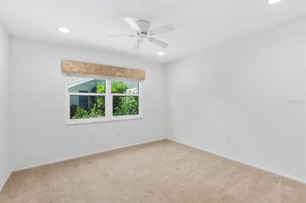 Guest Bedroom has newer carpeting and spacious enough for a Queen Bedroom set.