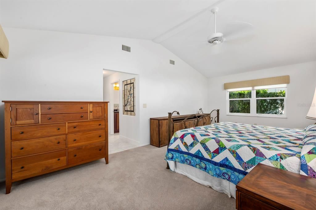 Owner's Suite with newer carpet, cathedral ceilings and plenty of light