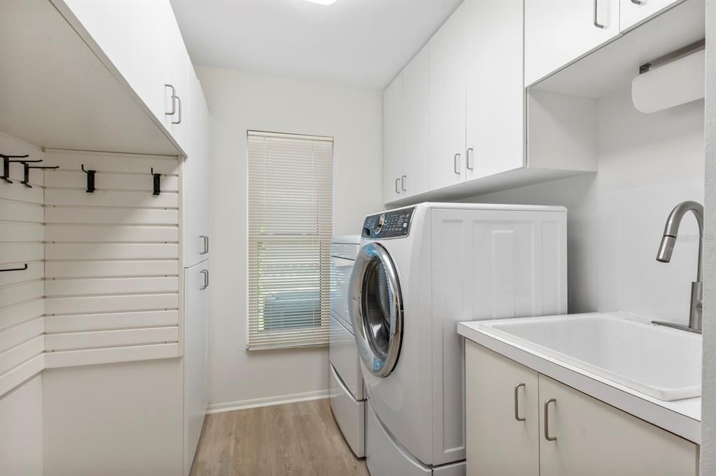 Handy laundry sink and more cabinet storage