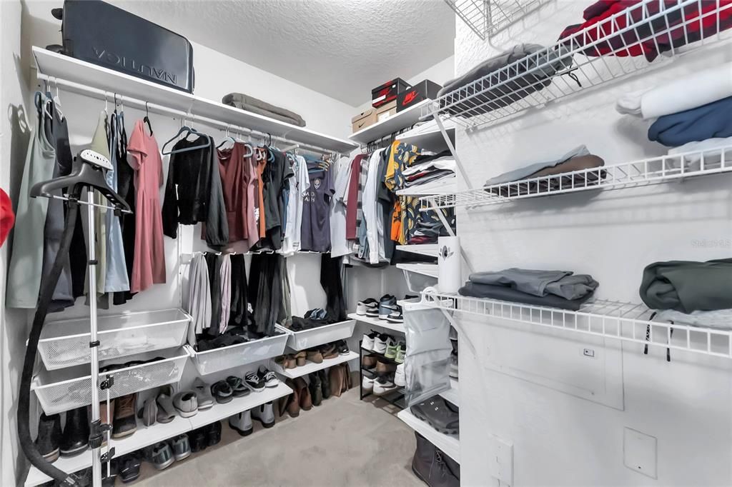 Primary Closet with built in shelves