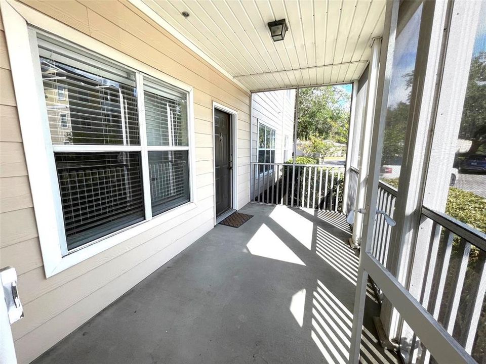 Spacious first floor porch with storage closet.