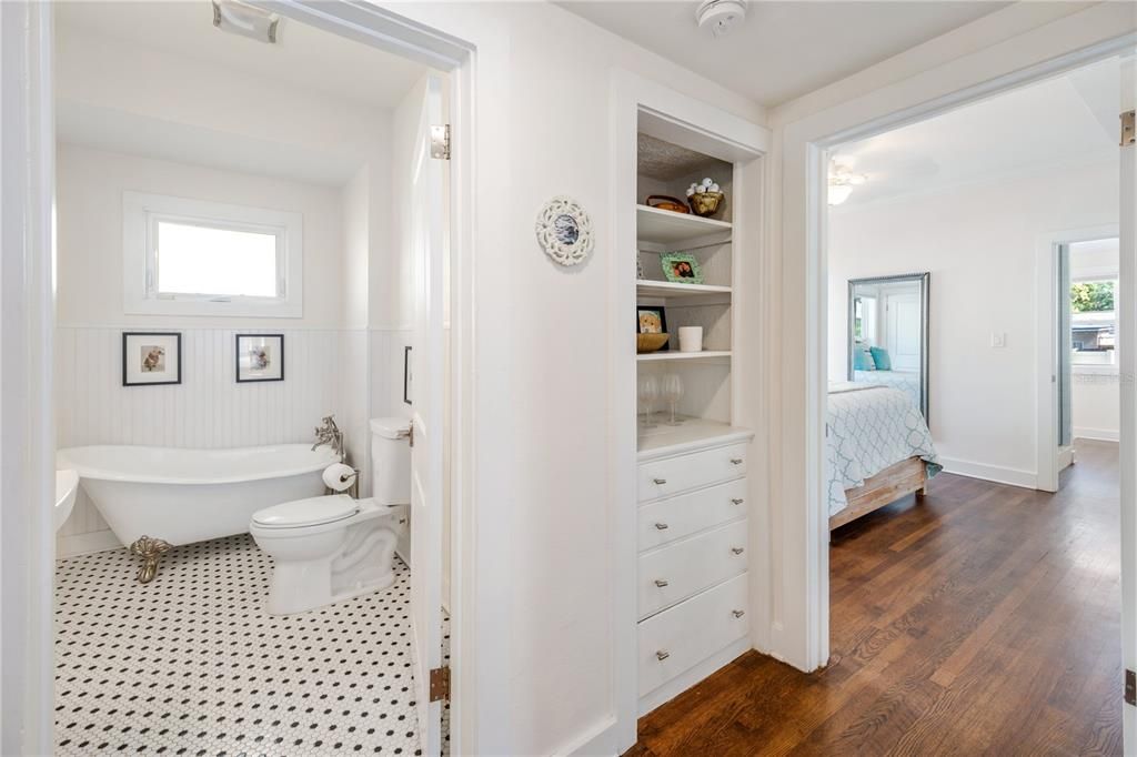 Downstairs Hallbath leading into Primary Bedroom and 2nd Full Bath