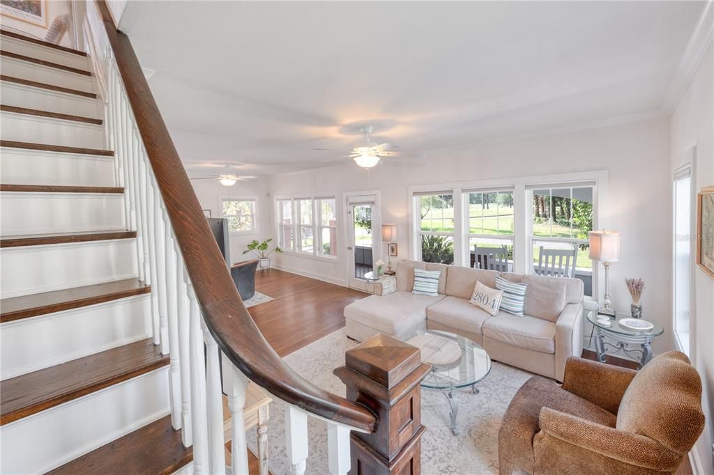 Stairway overlooking Living Area and out to Front Porch