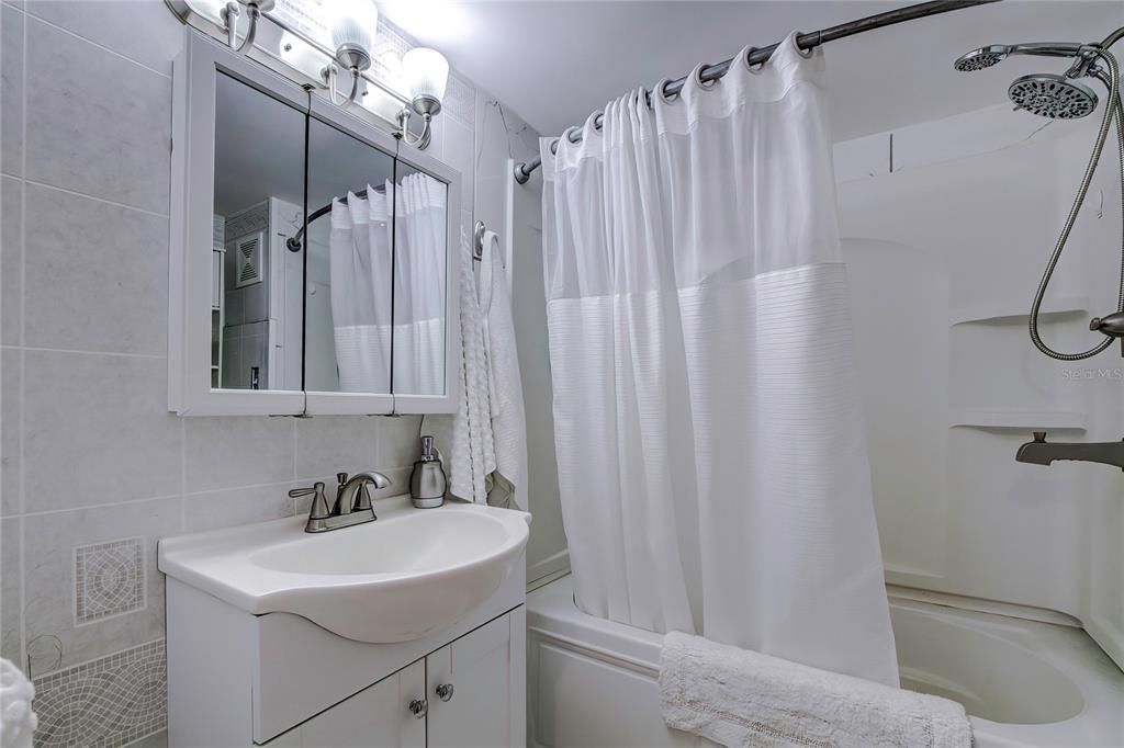 Bathroom has a rainfall shower head