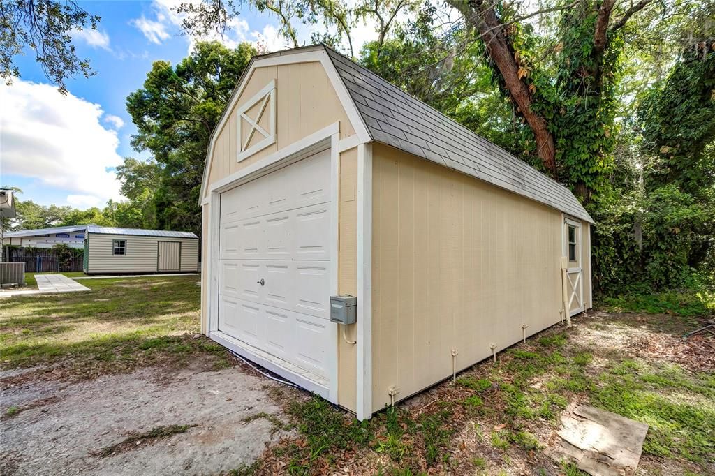 Large workshop has a garage door and a side door