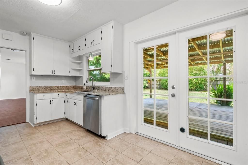 Kitchen french doors leading to backyard