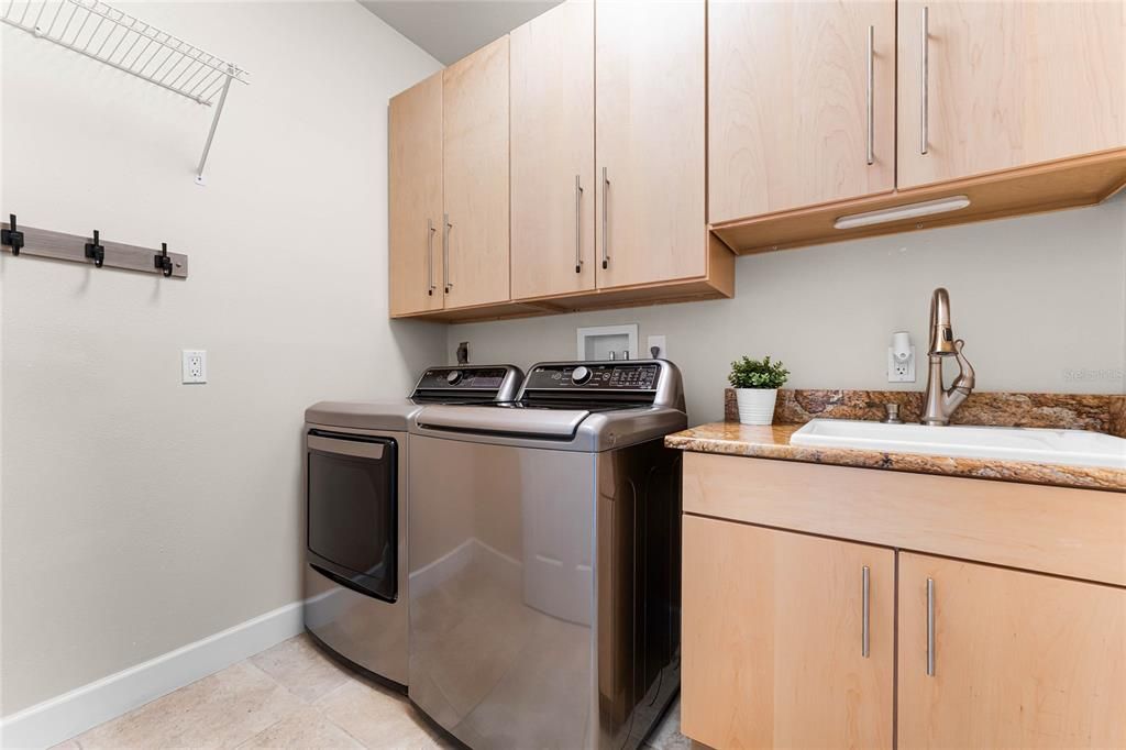 Private laundry room with washer and dryer conveying