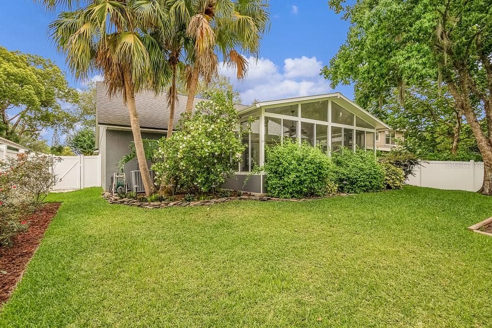 Spacious Yard with mature landscaping backing to greenbelt