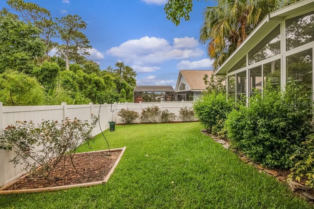 Spacious Yard with mature landscaping backing to greenbelt