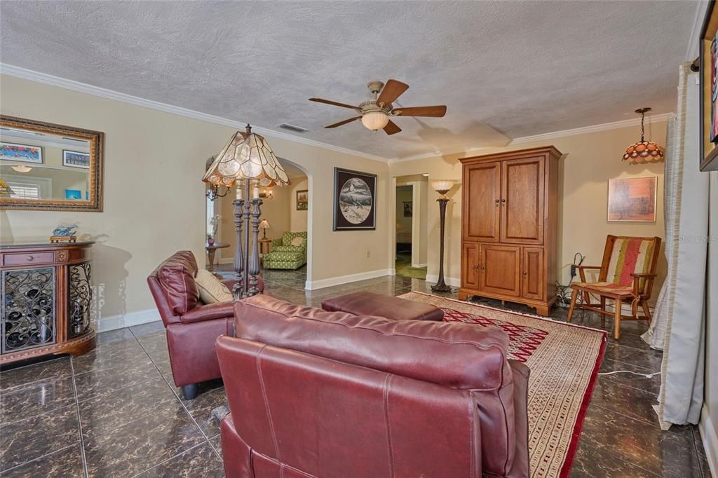 Reverse view of family room with peek into living room