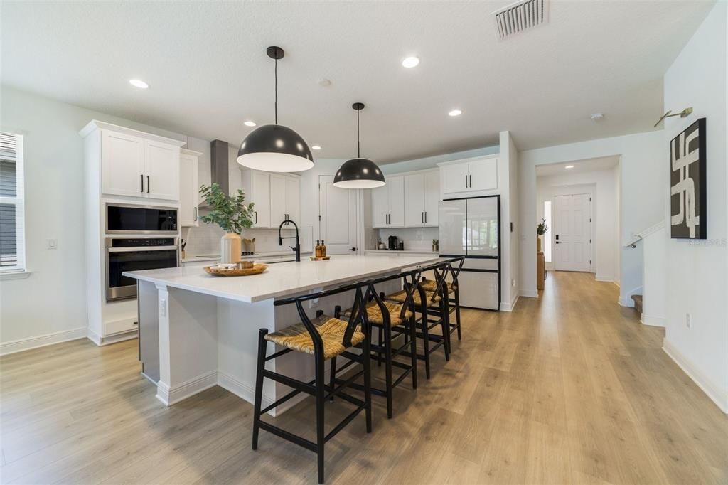 Don’t wait on a new build, this light and bright OPEN CONCEPT has been immaculately maintained with LAMINATE WOOD FLOORS in all the main living areas making maintenance a breeze and UPGRADES that look they were ripped out of the pages of a magazine.
