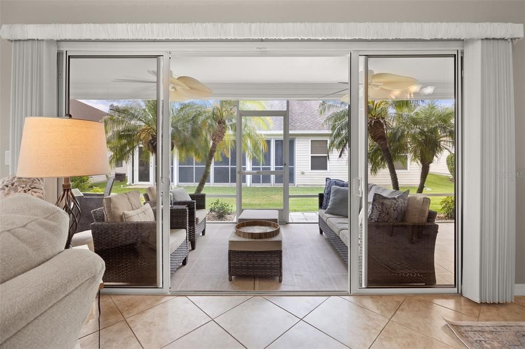 Sliding glass doors that lead to the lanai from the living room.