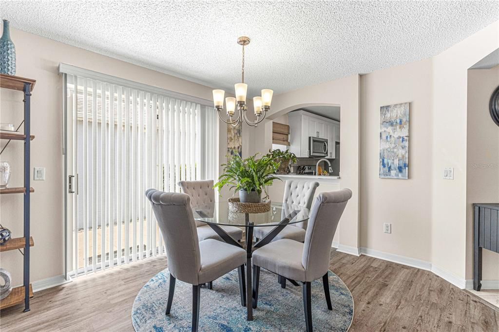 Dining Room with sliding doors and pass through to kitchen next to sliders