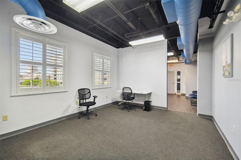 300 B Open workspace with windows viewing the city