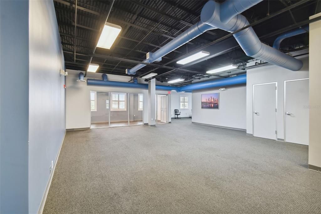 300 B Main room has 12 ft ceilings with decorative exposed ductwork