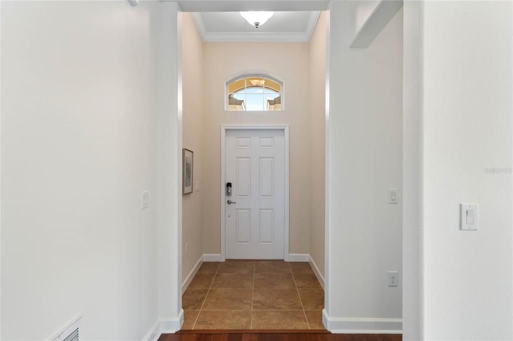 Foyer features a Transom Window and Smart Lock Access