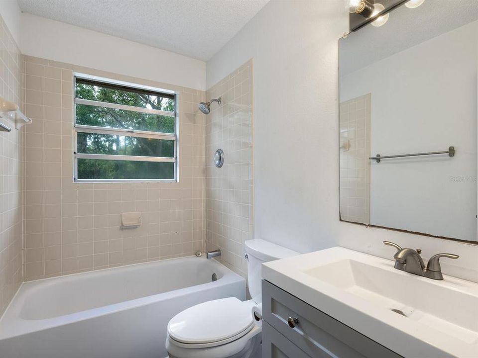 Bathroom with tub/shower combo.