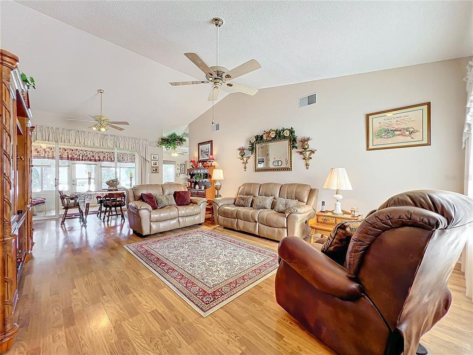 You’ll enjoy relaxing and entertaining in the large living area and dining room!  Laminate flooring adds a warm feeling. Vaulted ceiling