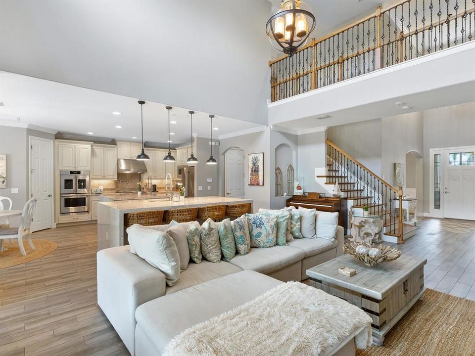 Over 4,300 sf of living space offering 6 bedrooms, 4.5 bathrooms, office, media and bonus room. Plank tile floors throughout the main living area and 20' ceilings in the living room and foyer.