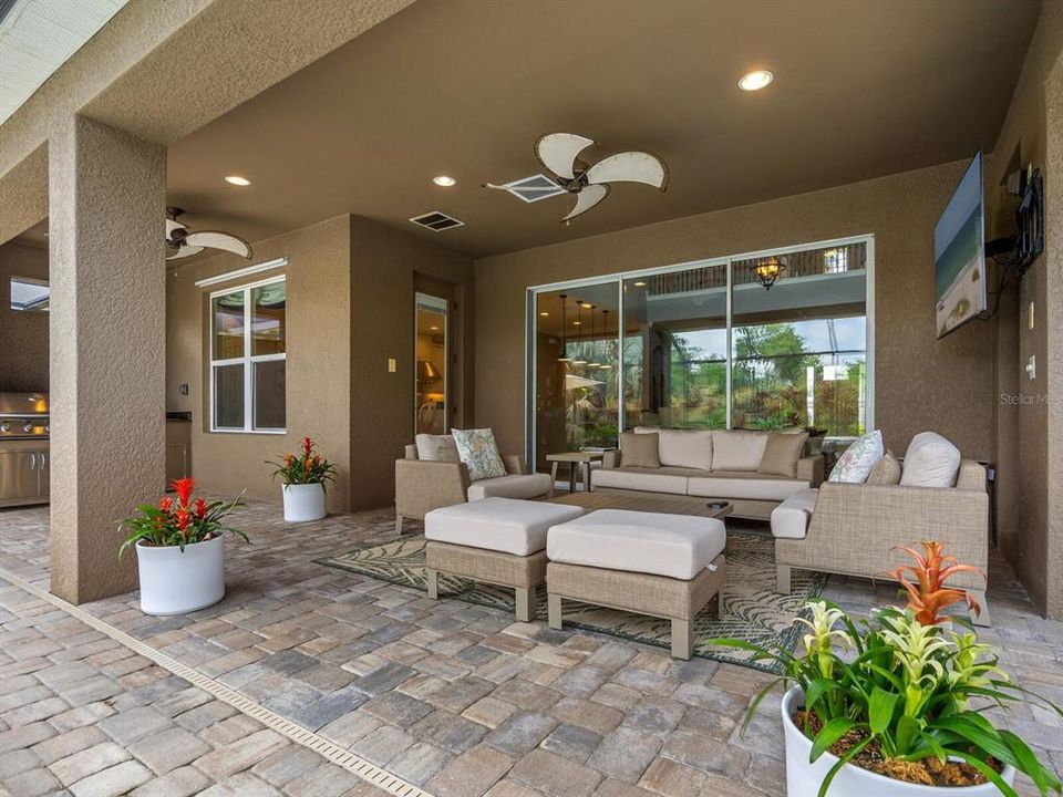 Enjoy the screened lanai with dining and living areas, outdoor kitchen, pool & spa.