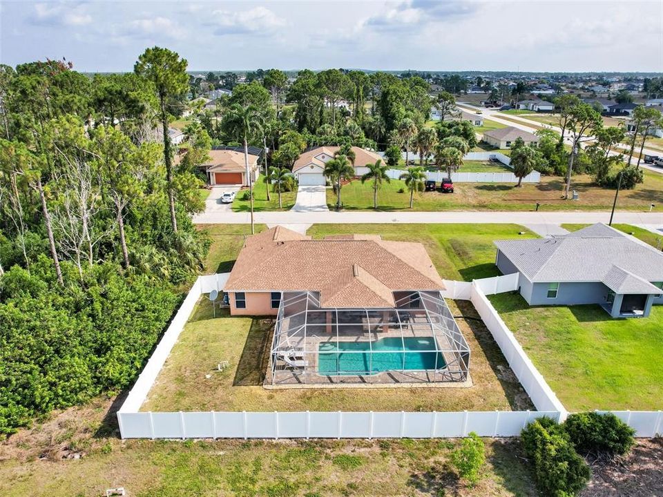 Backyard with Enclosed Pool and Vinyl Fencing