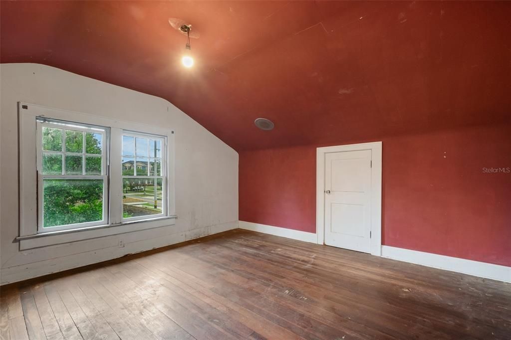 This bedroom has two spots to access the attic spaces.