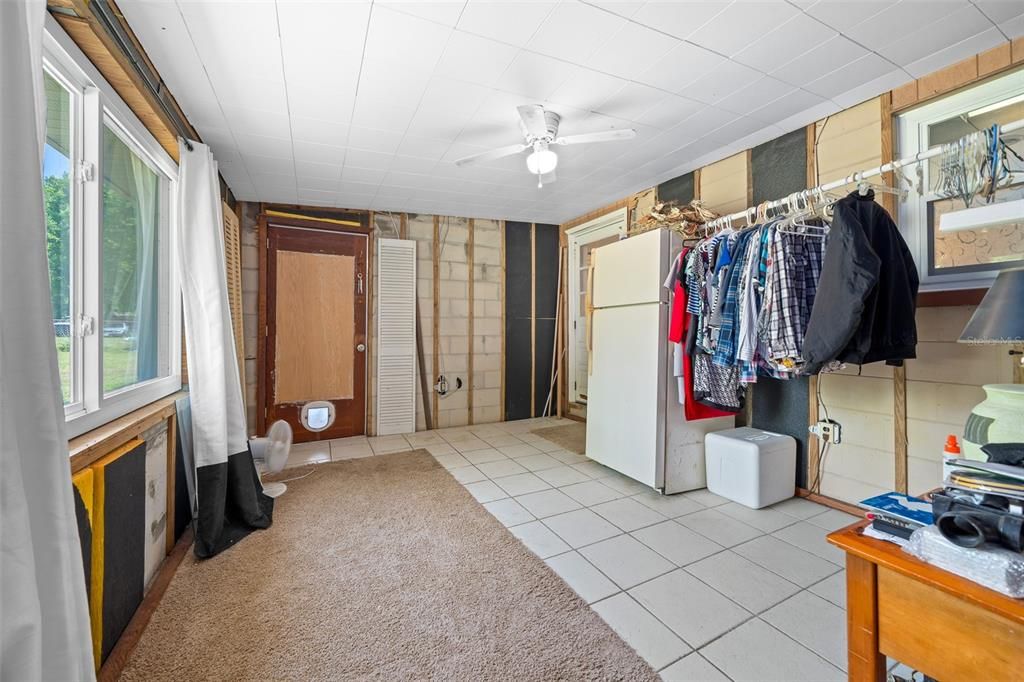 Back Storage Room with Door to Lanai & to Kitchen