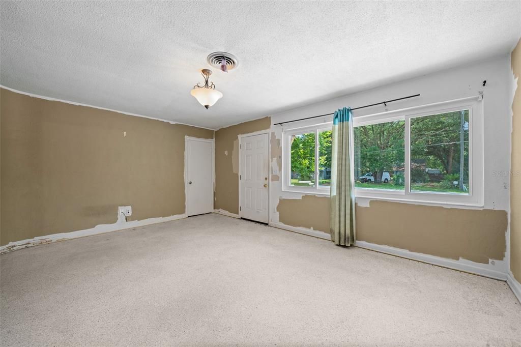 Formal Dining Room with Front Door. Coat Closet & Windows to Front Yard