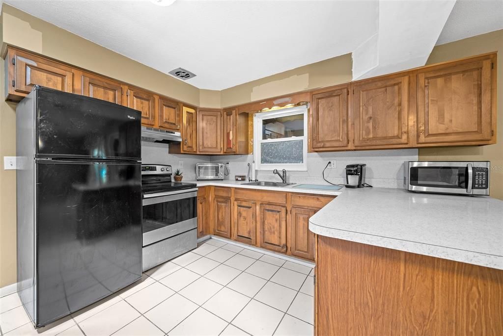 Kitchen with Window to Back Storage Room