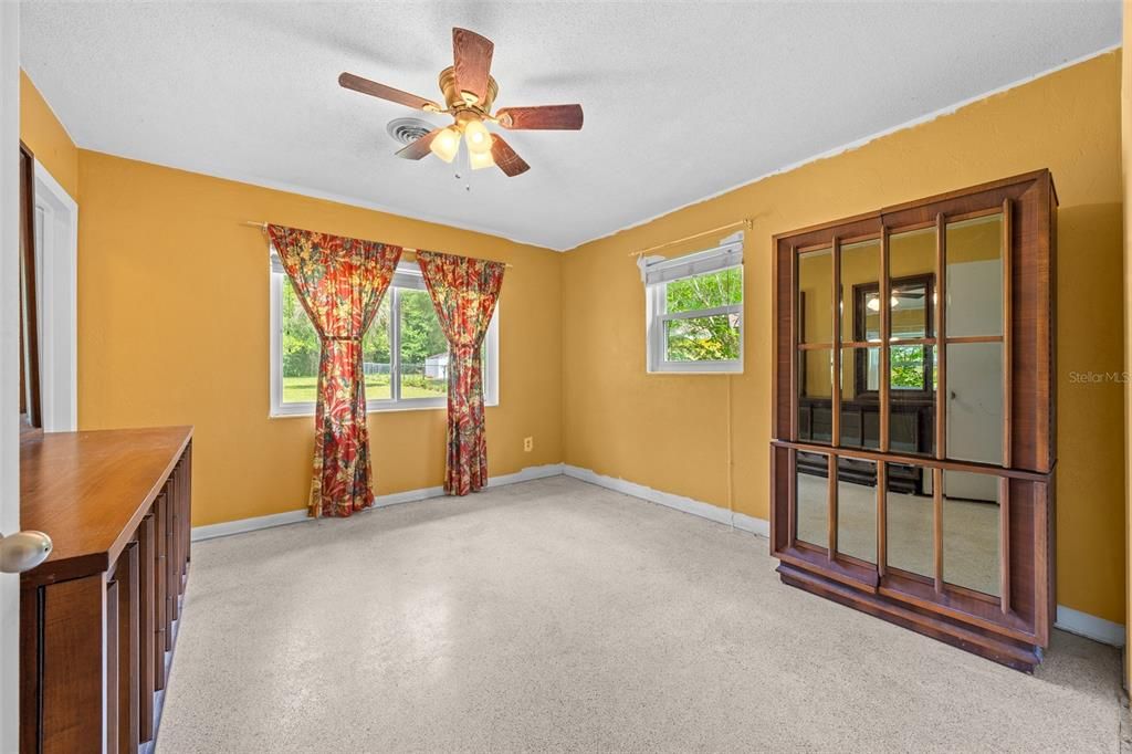 Owner's Bedroom with Ceiling Fan (Dressers Convey)