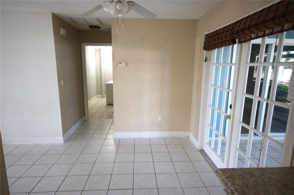 Dining area off the kitchen, French doors to Florida room/lanai