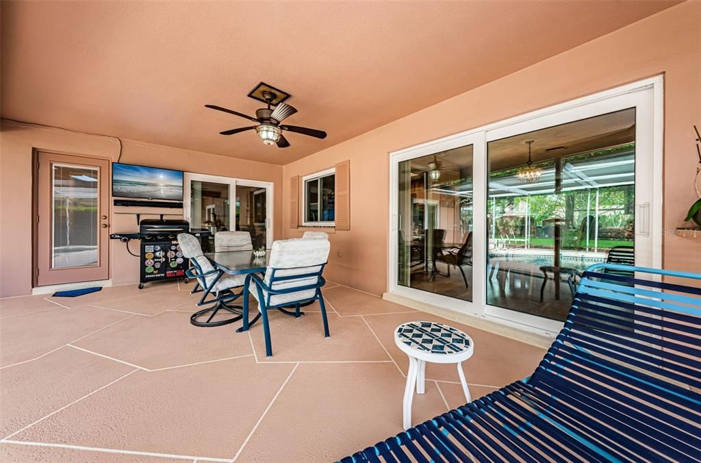 Worry free relaxation with a Pebble Sheen surfaced pool with pool sweep & cool deck patio with television and sound bar!  Impact Sliders!