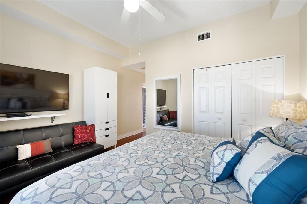 This bedroom is large enough for a small couch.  Plenty of closet spece for all those swimsuits!