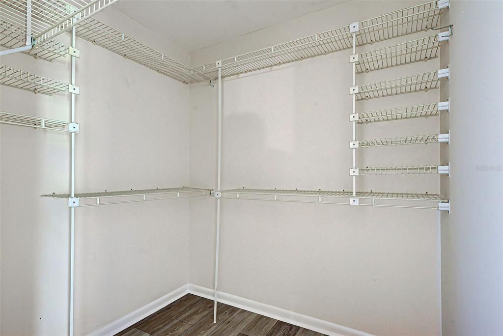 Primary suite has a spacious walk-in closet.