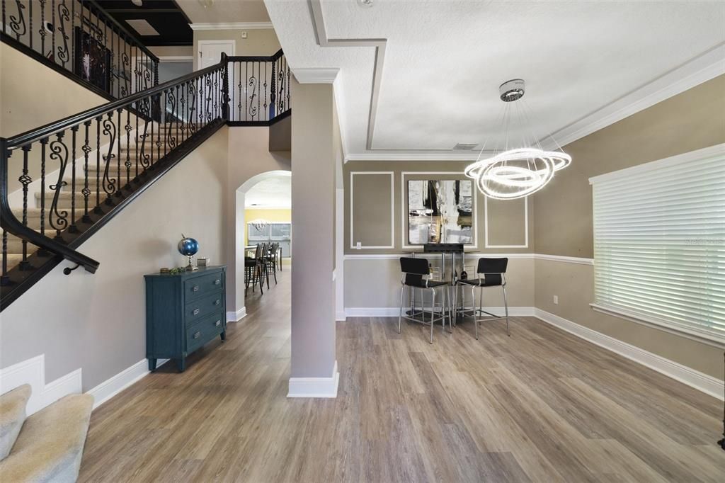 The new LUXURY VINYL PLANK FLOORING, custom woodwork (crown molding, chair rails and wainscoting), wrought iron spindles on the gorgeous staircase and upgraded foam insulation are just the beginning of the many things to love about this home.