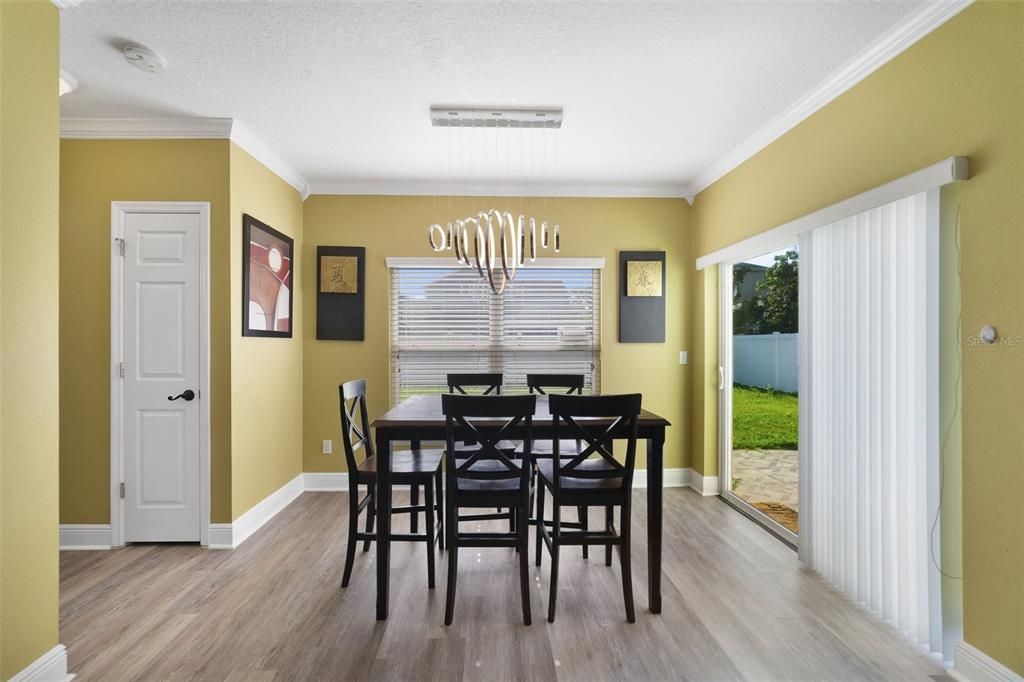 The open concept is highlighted by the large window, casual dining with sliding glass door access to a PAVER PATIO and spacious kitchen the home chef is sure to love.