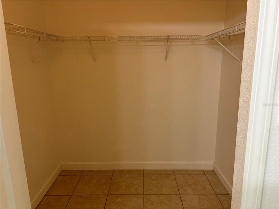 Primary bedroom walk-in closet