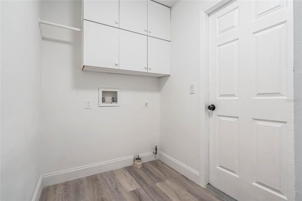 Laundry Inside,  cabinets, and hanging rack