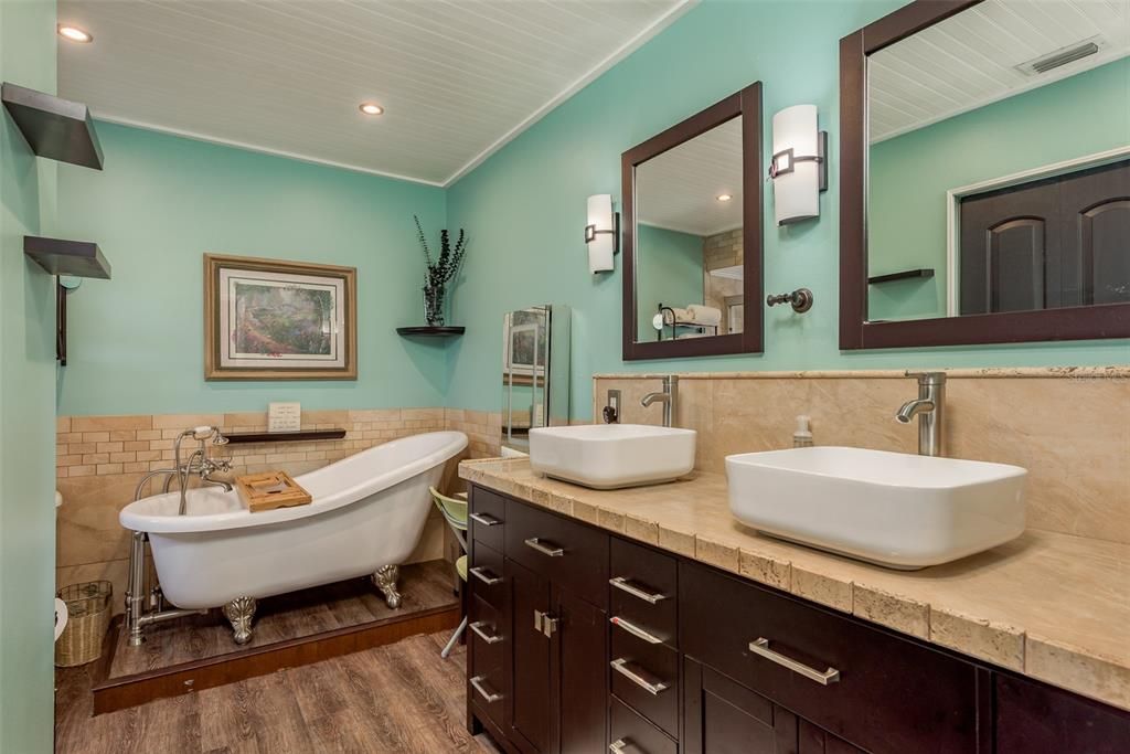 primary bathroom, dual sinks claw tub and shower