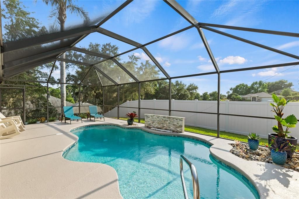 Beautiful heated pool with newer equipment as well as a newer vinyl fence to enjoy your privacy